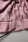 Vestido de noche largo con lentejuelas y adornos rosa de Dolce & Gabbana