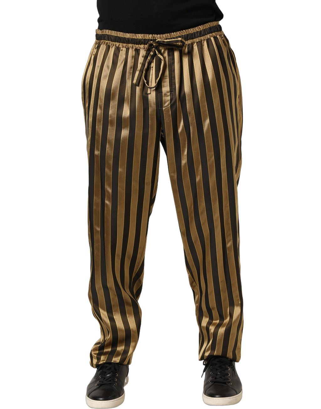 Pantalones con pernera entallada de satén a rayas doradas y negras de Dolce & Gabbana