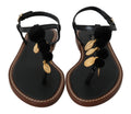 Sandalias planas con tira al tobillo y pompón de Dolce & Gabbana