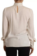 Top Dolce & Gabbana de cuello alto de seda blanco roto y manga larga