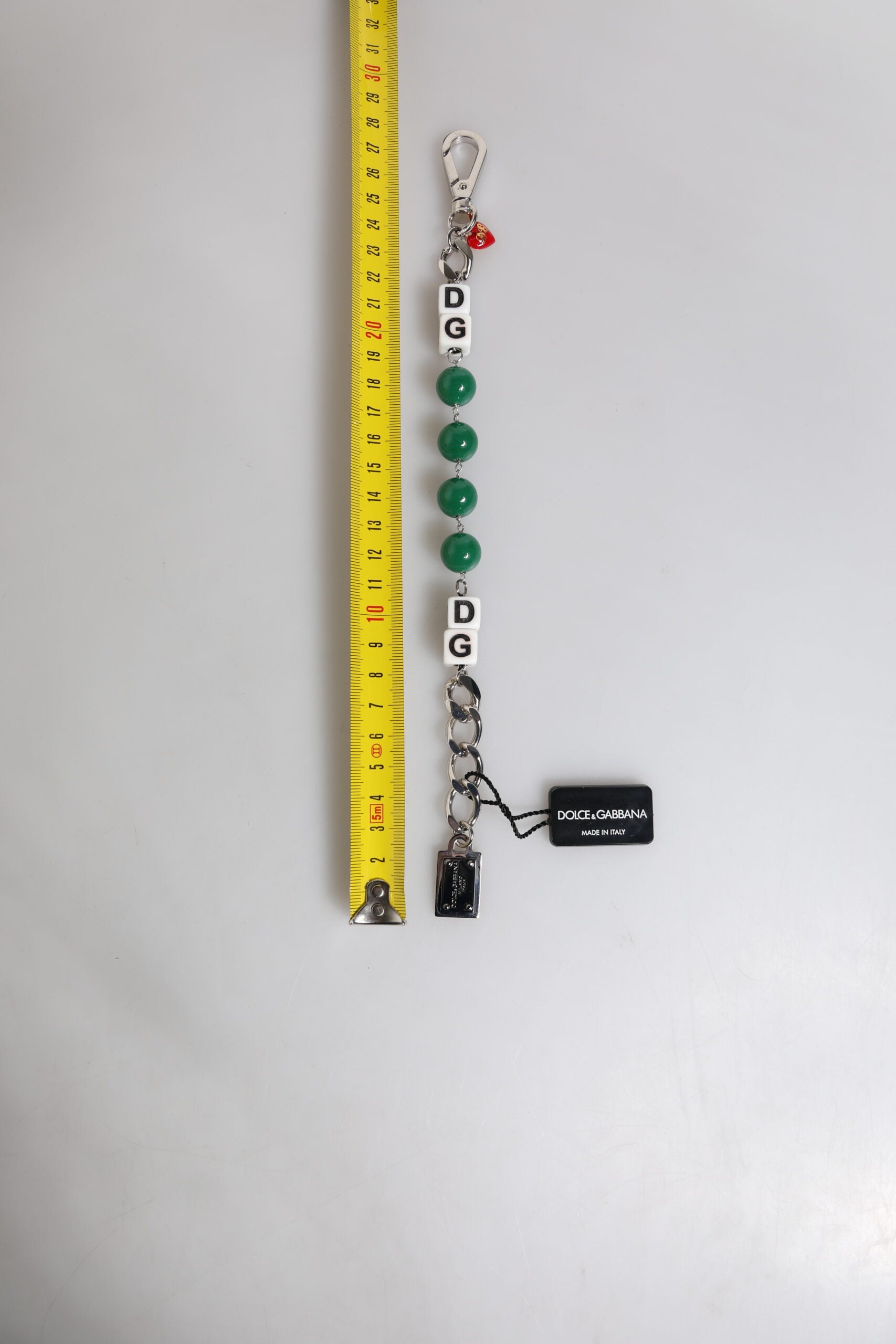 Pulsera con dije adornado con logo de dados de latón en tono plateado de Dolce & Gabbana