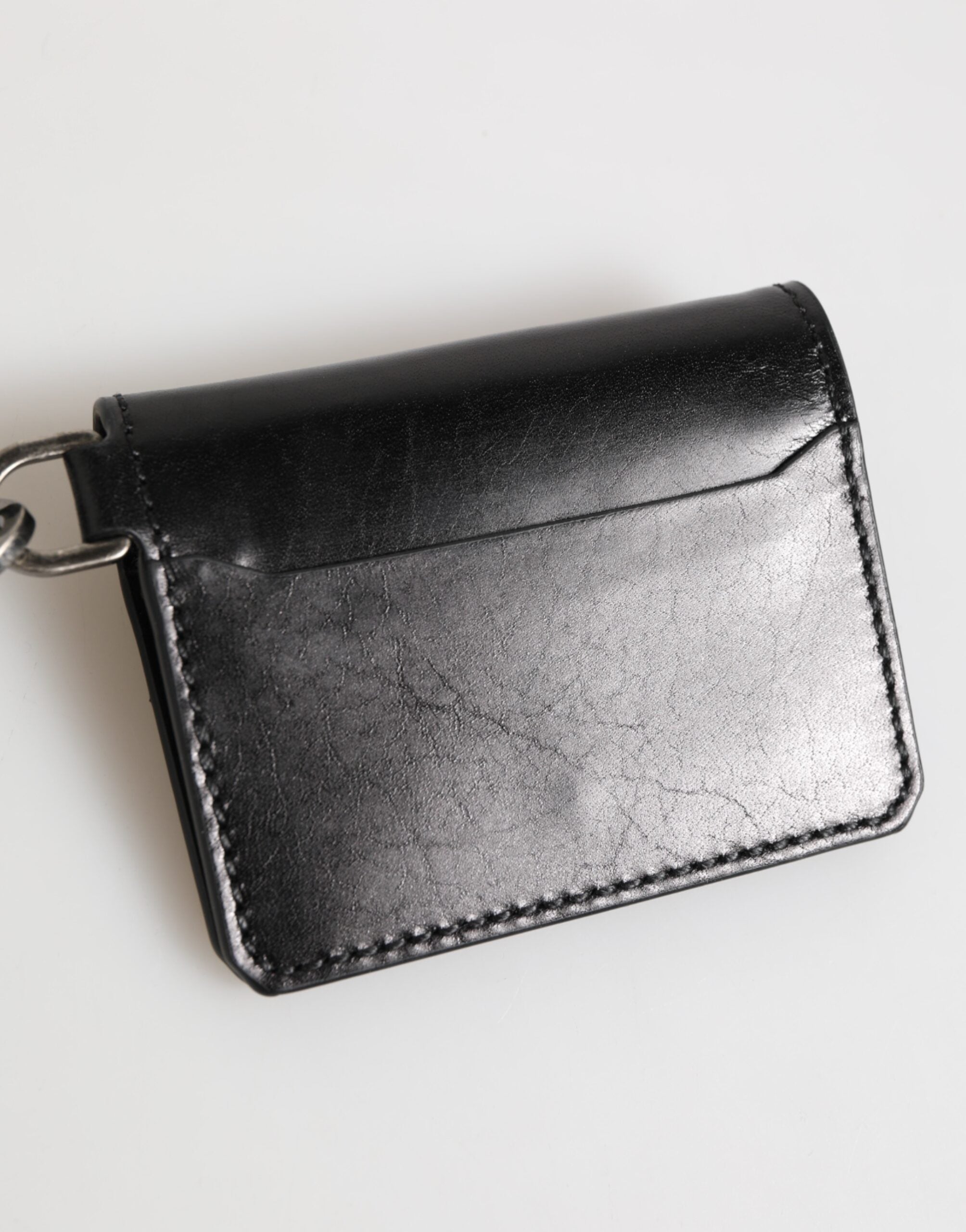 Cartera Dolce & Gabbana de piel negra con logo grabado y tarjetero con llavero